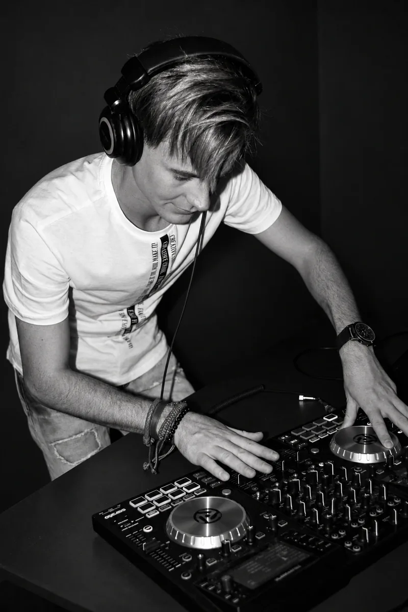 Editorial black-and-white edit of DJ NINE SA at the decks